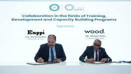 جانب من توقيع الاتفاقية بين إنبي ووود