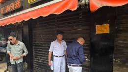 تشميع محال تجارية بشارع فيصل للعمل بدون ترخيص